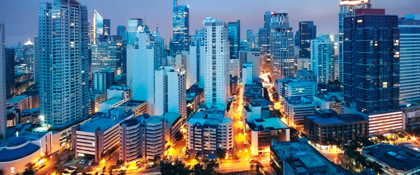 A wide panoramic view of the Makati CBD skyline, highlighting prime office towers, corporate headquarters, and high-rise condominiums.
