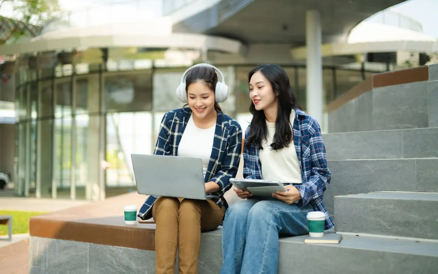 Two college students studying on a university campus in Taft Manila