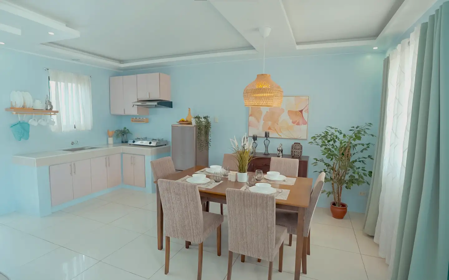 Dressed-up model unit showing the dining and kitchen areas